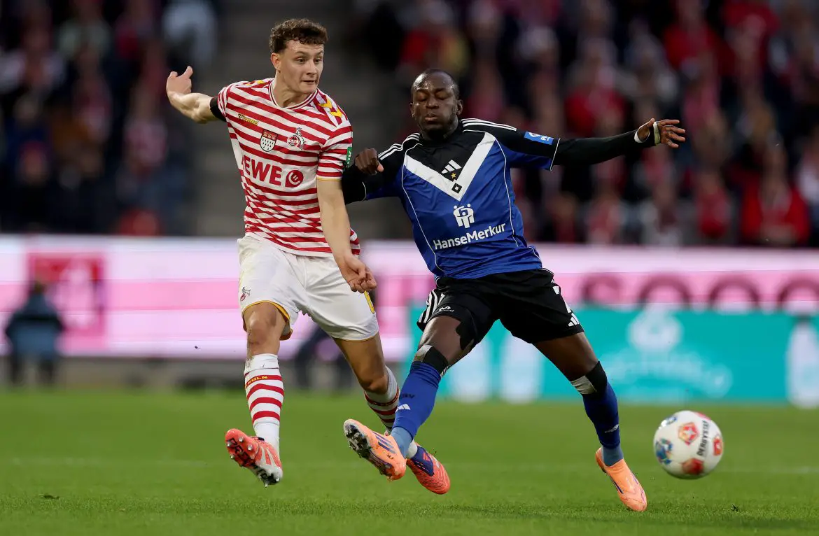 Eric Martel (l) of Colgone and Jean-Luc Dompe (r) of Hamburg in a Bundesliga match.