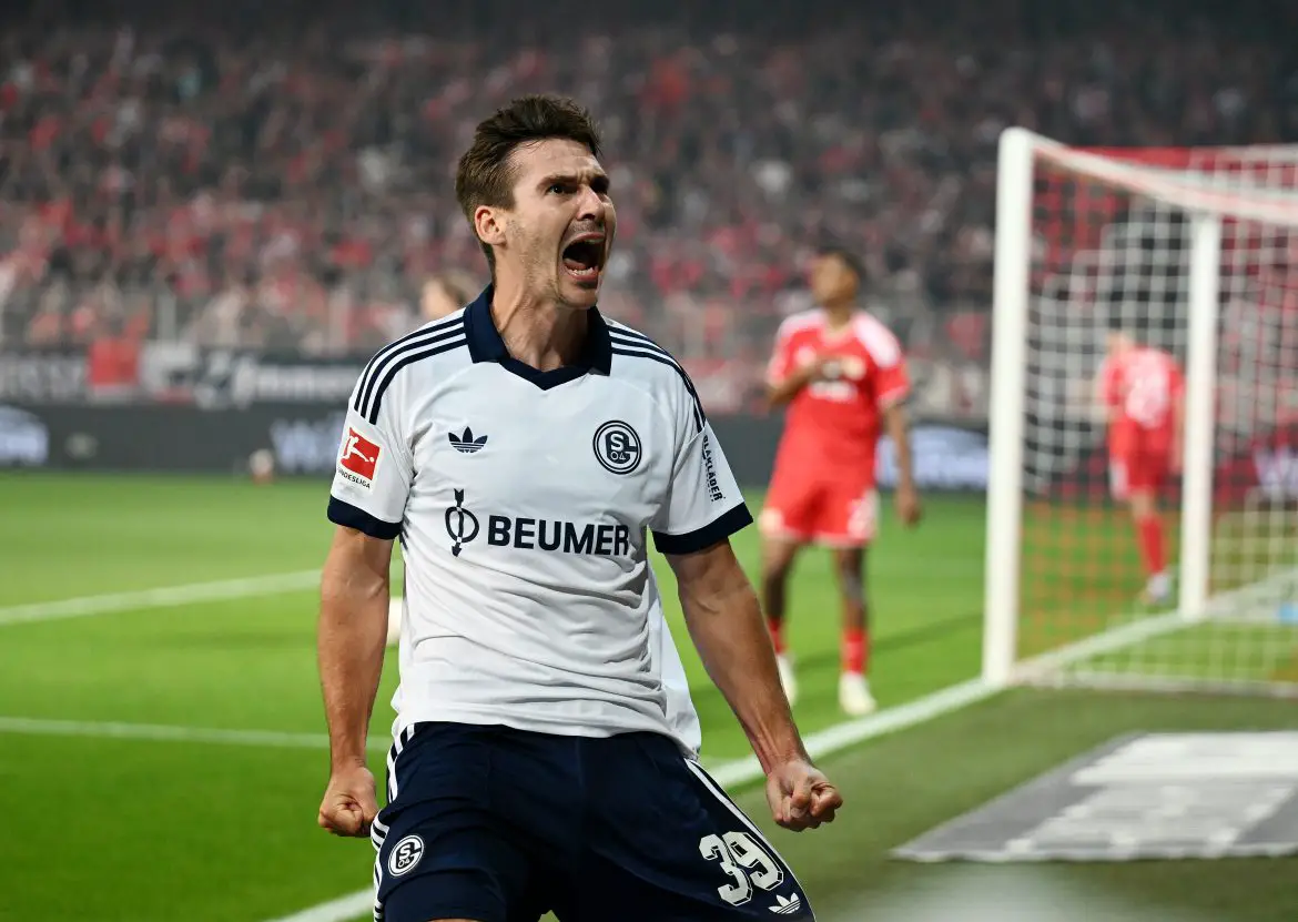 Schalke 04's Maximilian Wöber celebrates scoring a crucial Bundesliga goal.