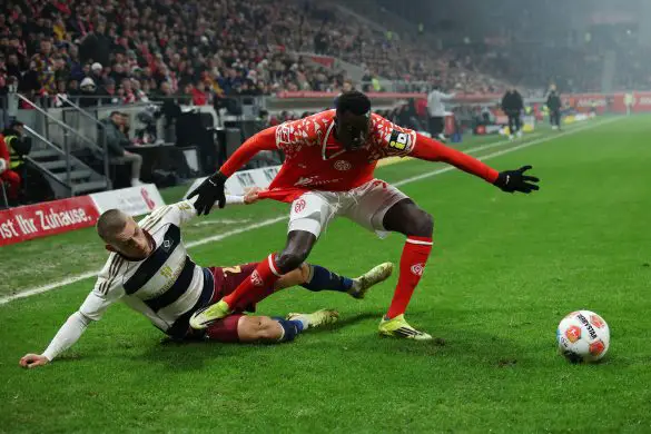 Hamburg's Miro Muheim (left) and Mainz's Silas (right) during a highly controversial scene in Friday night's 1-1 Bundesliga draw.