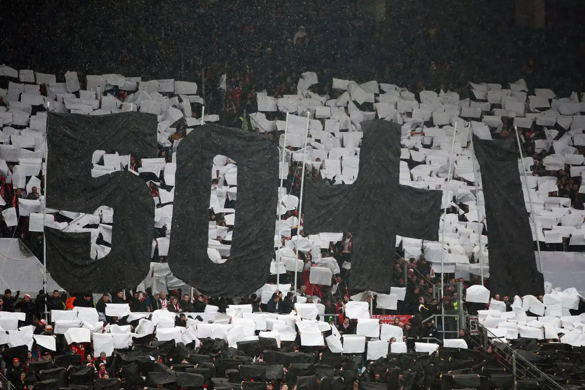 German football fans show their support for the 50+1 fan ownership principle at a Bundesliga match.