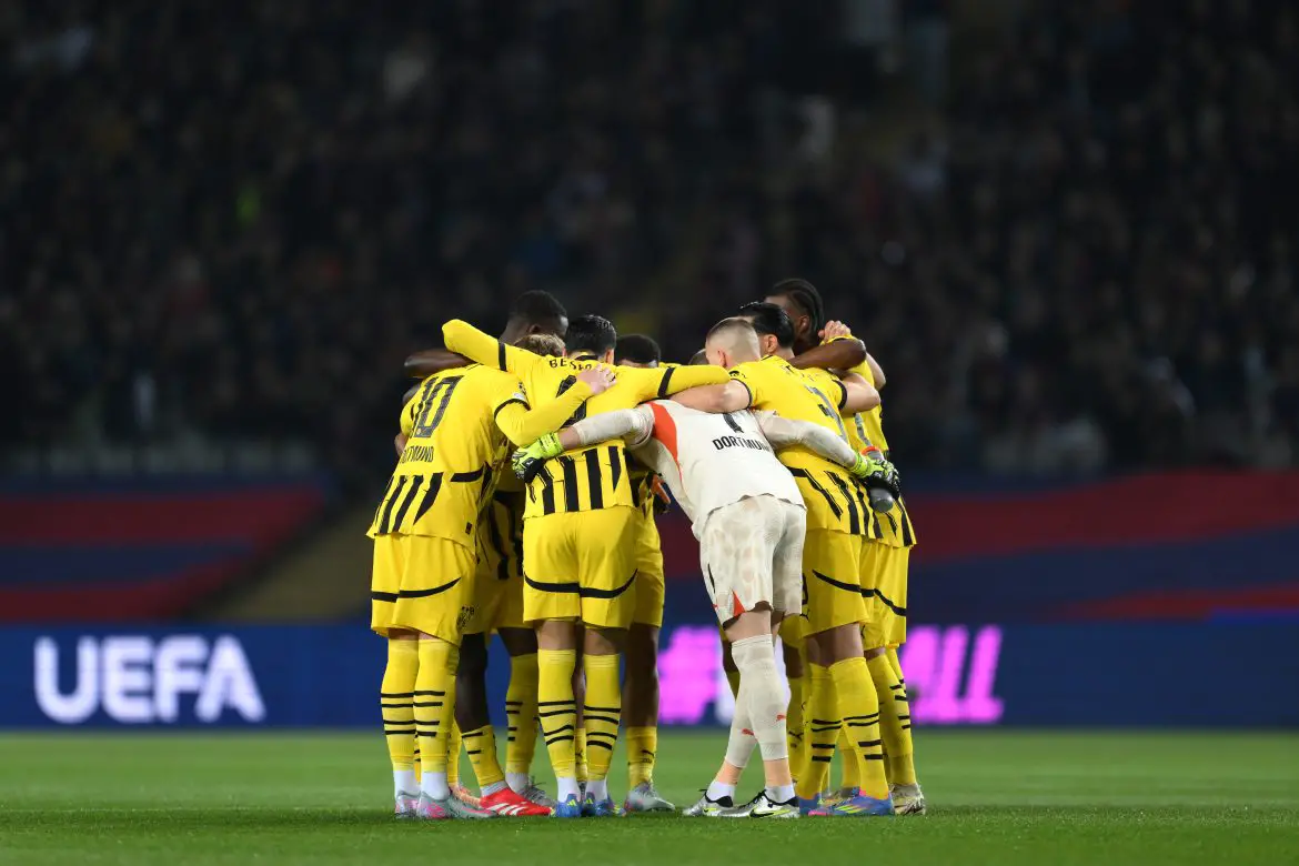 Borussia Dortmund players in a huddle ahead of their UEFA Champions League game against Barcelona.
