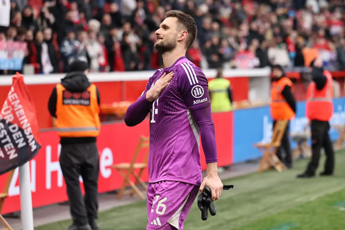 Bayern Munich keeper Sven Ulreich acknowledges the traveling supporters after Saturday's Bundesliga draw with Bayer Leverkusen.