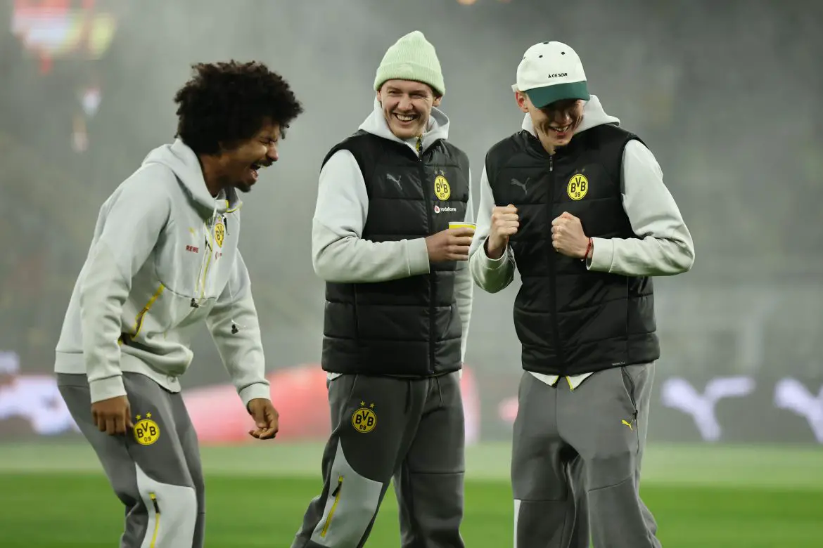 Borussia Dortmund teammates and Niko Kovac 'disciples" Karim Adeyemi (left), Julian Brandt (center), and Maximilian Beier (right) share a laugh prior to a Bundesliga match.
