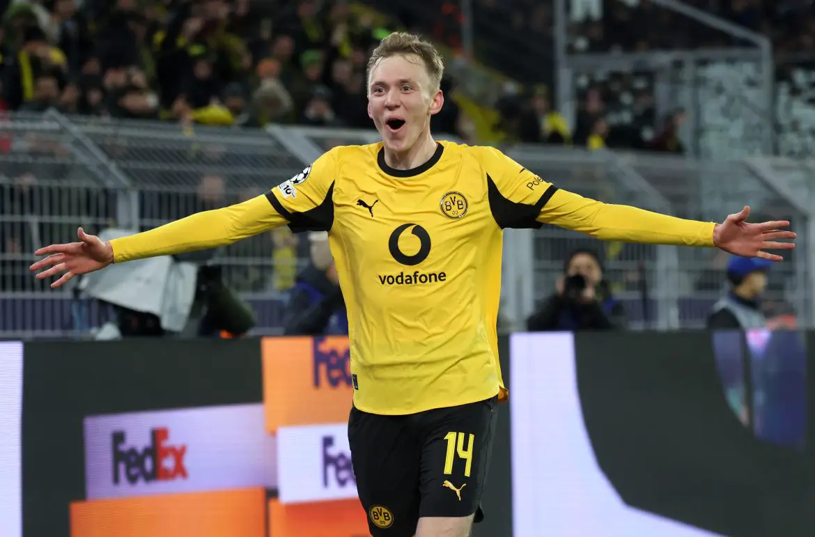 Borussia Dortmund and Premier League transfer target Maximilian Beier celebrates scoring a goal in the Champions League.