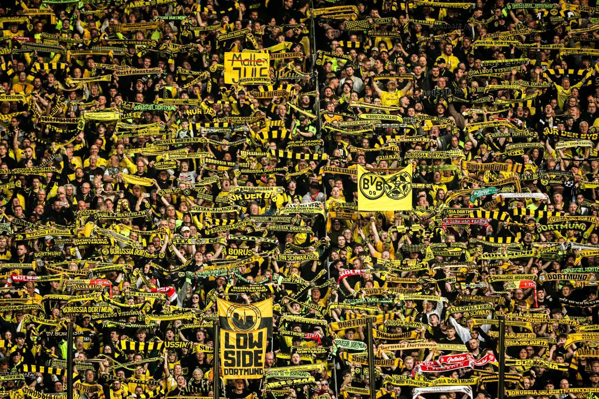 Fans of Borussia Dortmund support their Bundesliga club.