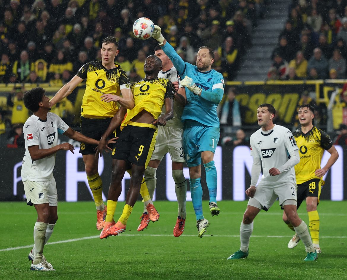 Borussia Dortmund and Hoffenheim players clash.