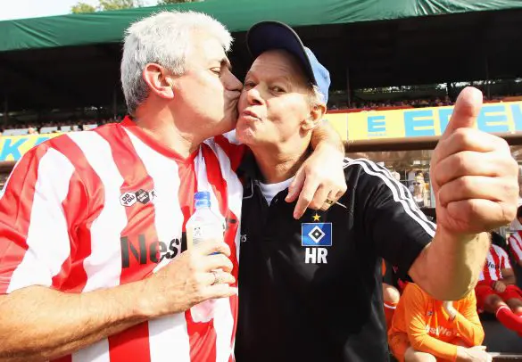 Kevin Keegan kisses Hamburg physio Hermann Rieger prior to a "legends" match in 2011.