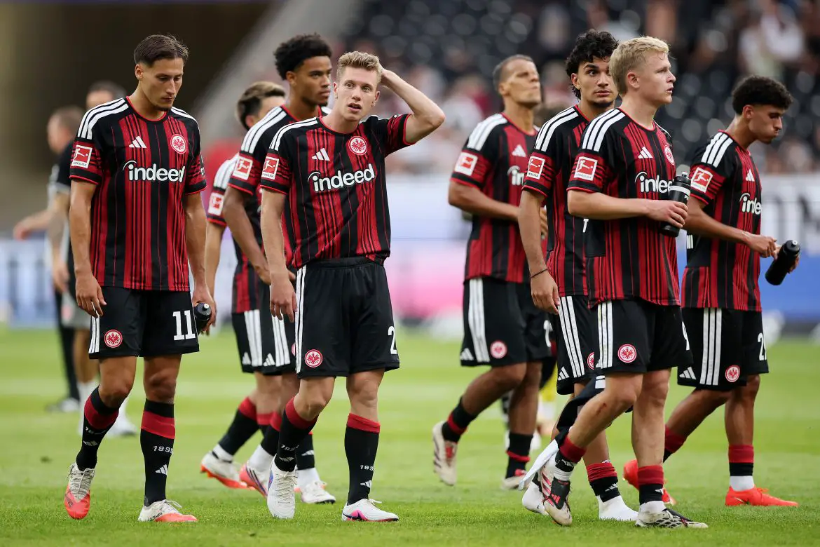 Eintracht Frankfurt players react after Sunday's Bundesliga defeat against Augsburg.