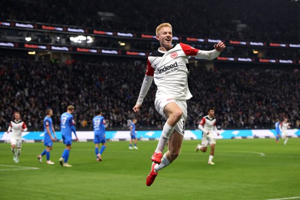 Hugo Larsson celebrating scoring a goal for Eintracht Frankfurt in the Bundesliga.