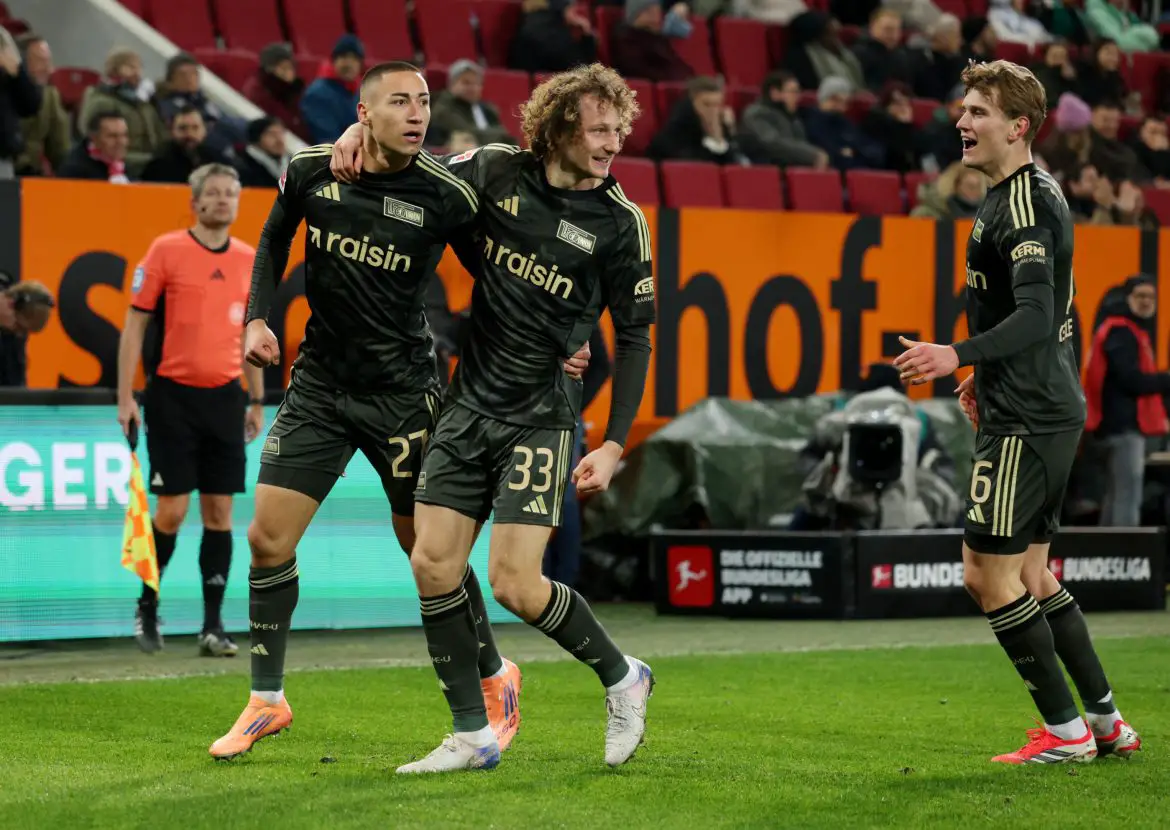 Marin Ljubicic (left) and Alex Kral (right) celebrate scoring a late equalizer against Augsburg in the Bundesliga on Thursday night.
