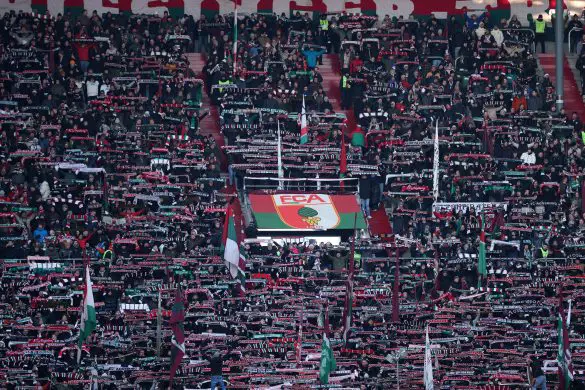 Fans of FC Augsburg show their support prior to a Bundesliga match