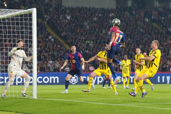 Raphinha heads the ball to Robert Lewandowski's second goal for Barcelona against Borussia Dortmund in the Champions League.
