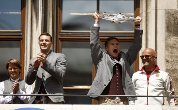 Joshua Kimmich celebrates lifting the Bundesliga title as Bayern Munich's Marienplatz ceremony.