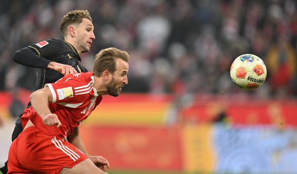 Arthur Chaves of Augsburg (top left) tussles with Bayern Munich's Harry Kane (bottom right) in the Bundesliga on Saturday.
