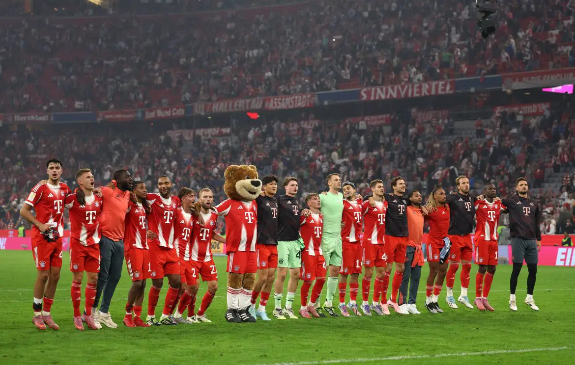 Bayern Munich players greet the FanKurve after Saturday night's Bundesliga victory.