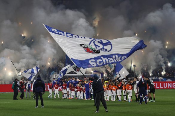 Schalke 04 flag waver ahead of their 2. Bundesliga game against Magdeburg.
