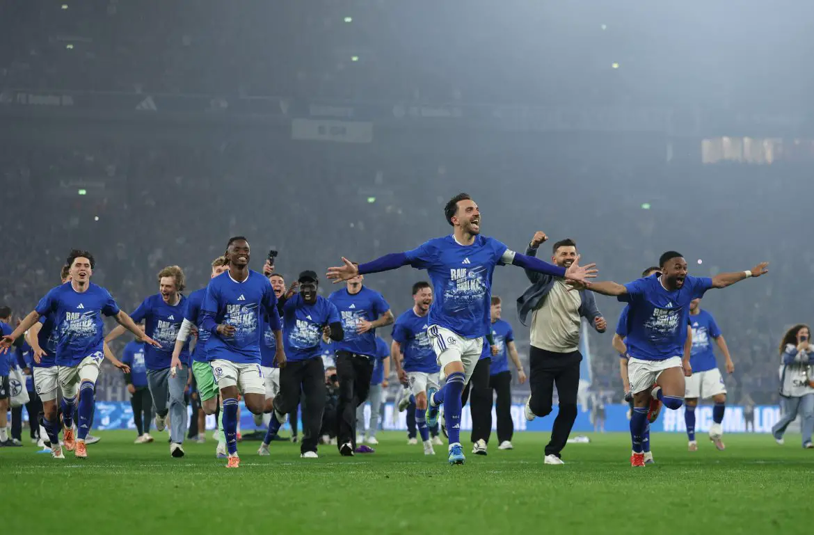 Schalke celebrate after securing their return to the Bundesliga.