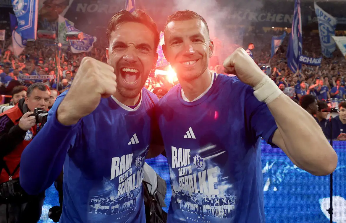 Schalke's Kenan Karaman (left) and Edin Dzeko (right) celebrate promotion to the Bundesliga.