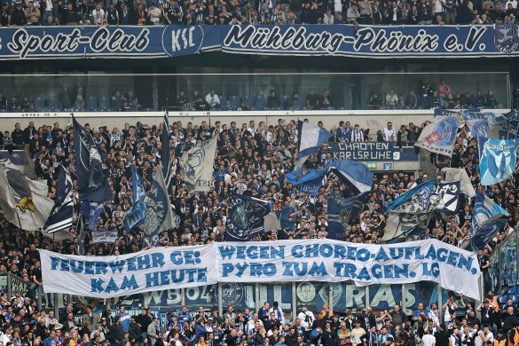 German football fans unfurl a banner during the 2. Bundesliga match between Schalke 04 and Karlsruher SC.