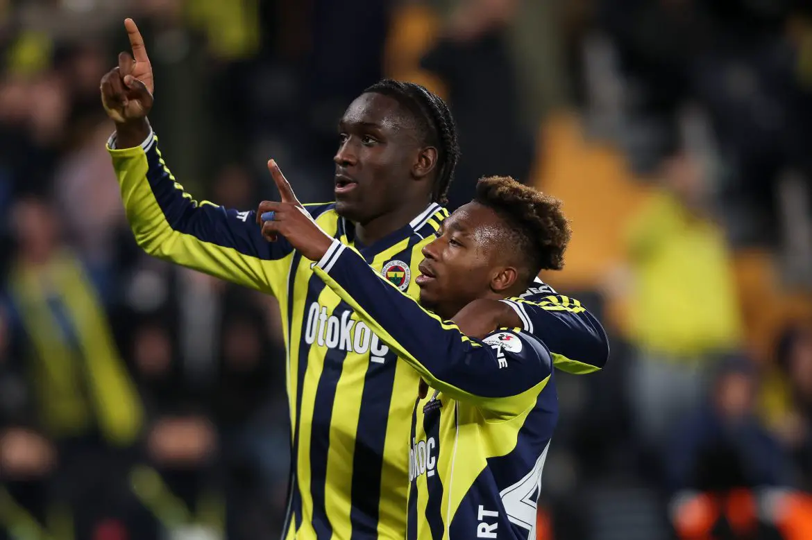 Fenerbahce striker Sidiki Chérif (left) celebrates a Süper Lig goal with a teammate.
