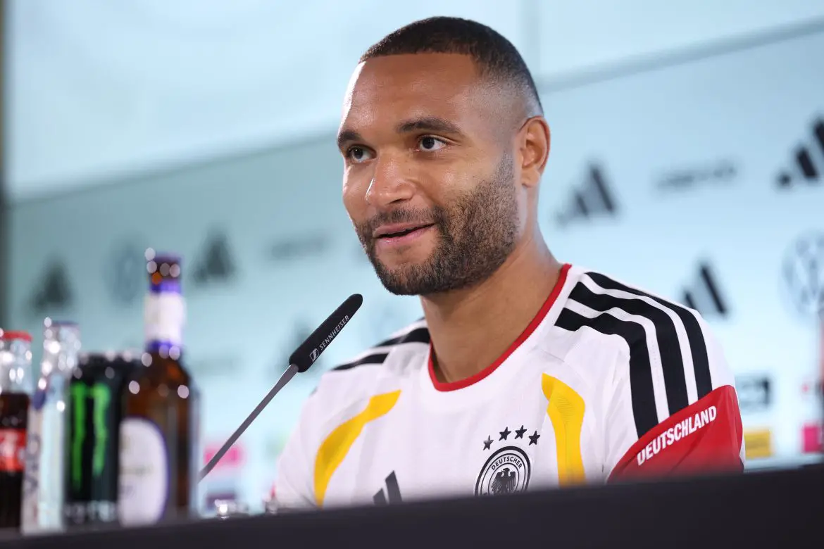 Jonathan Tah speaks to members of the press ahead of Germany's game against Luxembourg.