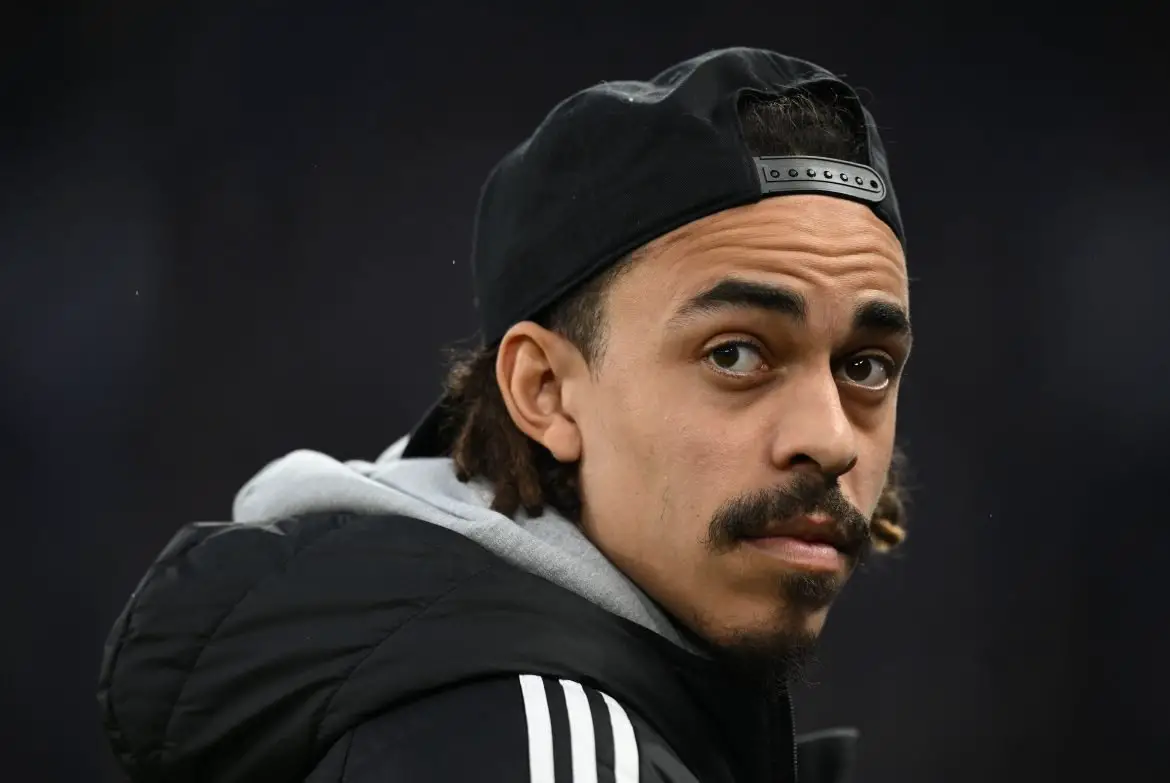Hamburg captain Yussuf Poulsen watches a Bundesliga match from the sidelines.