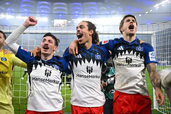 Hamburg captain Yussuf Poulsen (center) celebrating before the Hamburg FanKurve after Sunday's Bundesliga victory.