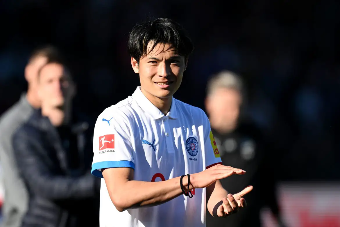 Holstein Kiel striker Shuto Machino celebrating victory over Borussia Mönchengladbach.