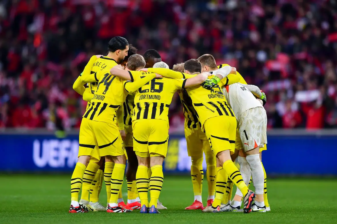 Borussia Dortmund players in a team huddle prior to their UEFA Champions League game against Lille.