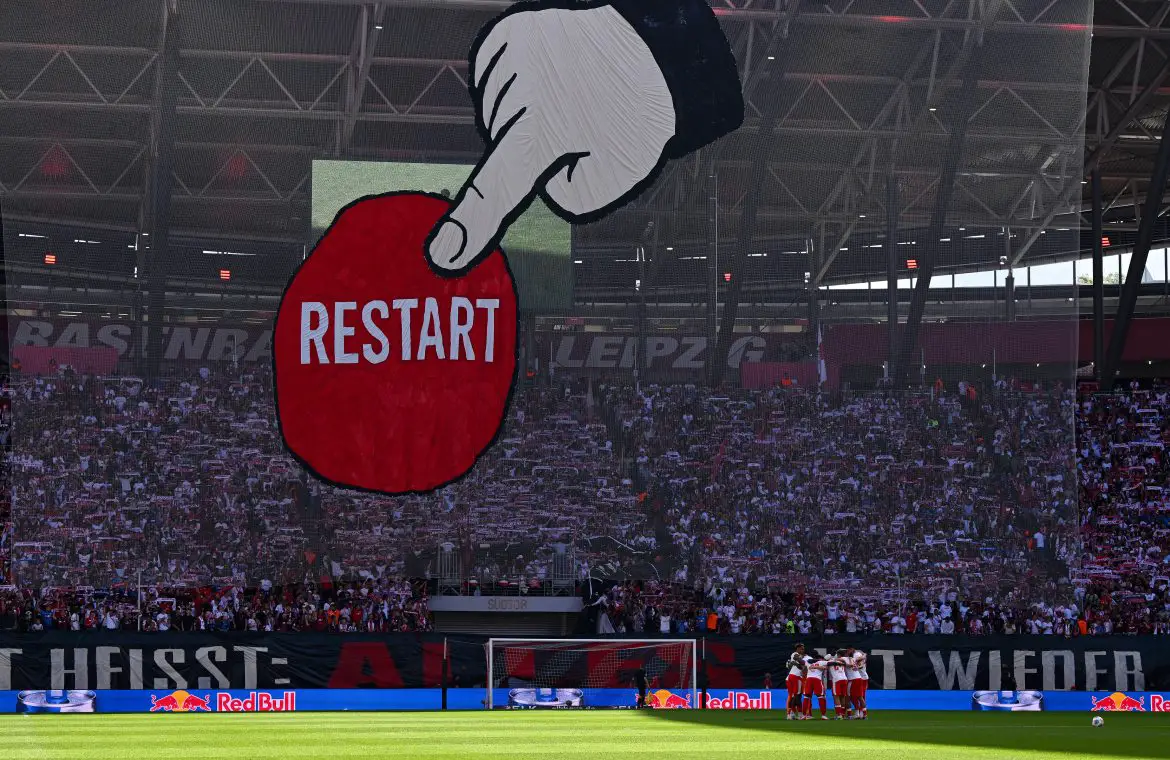 RB Leipzig supporters unfurl a "restart" banner ahead of their home Bundesliga opener.