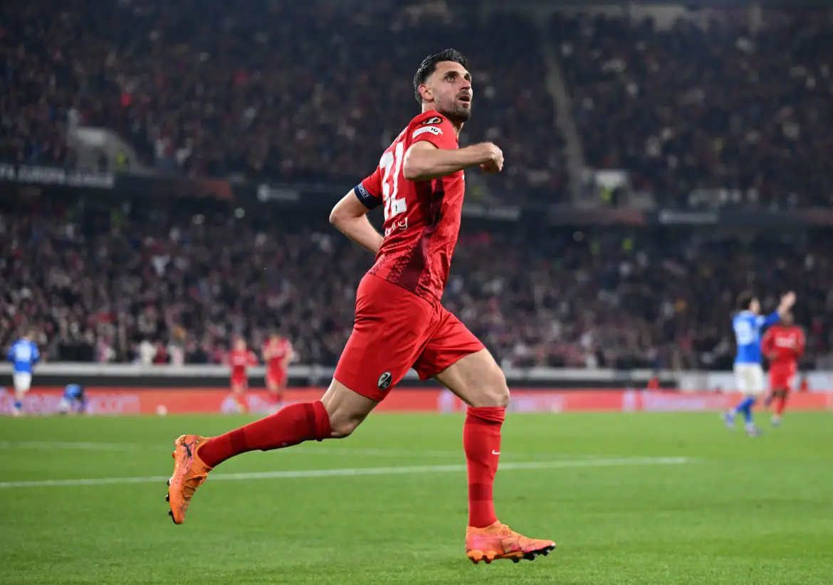 Freiburg's Vincenzo Grifo glances up at the Freiburg FanKurve to observe displays dedicated to him after becoming Freiburg's record club goal-scorer during Thursday night's Europa League victory.