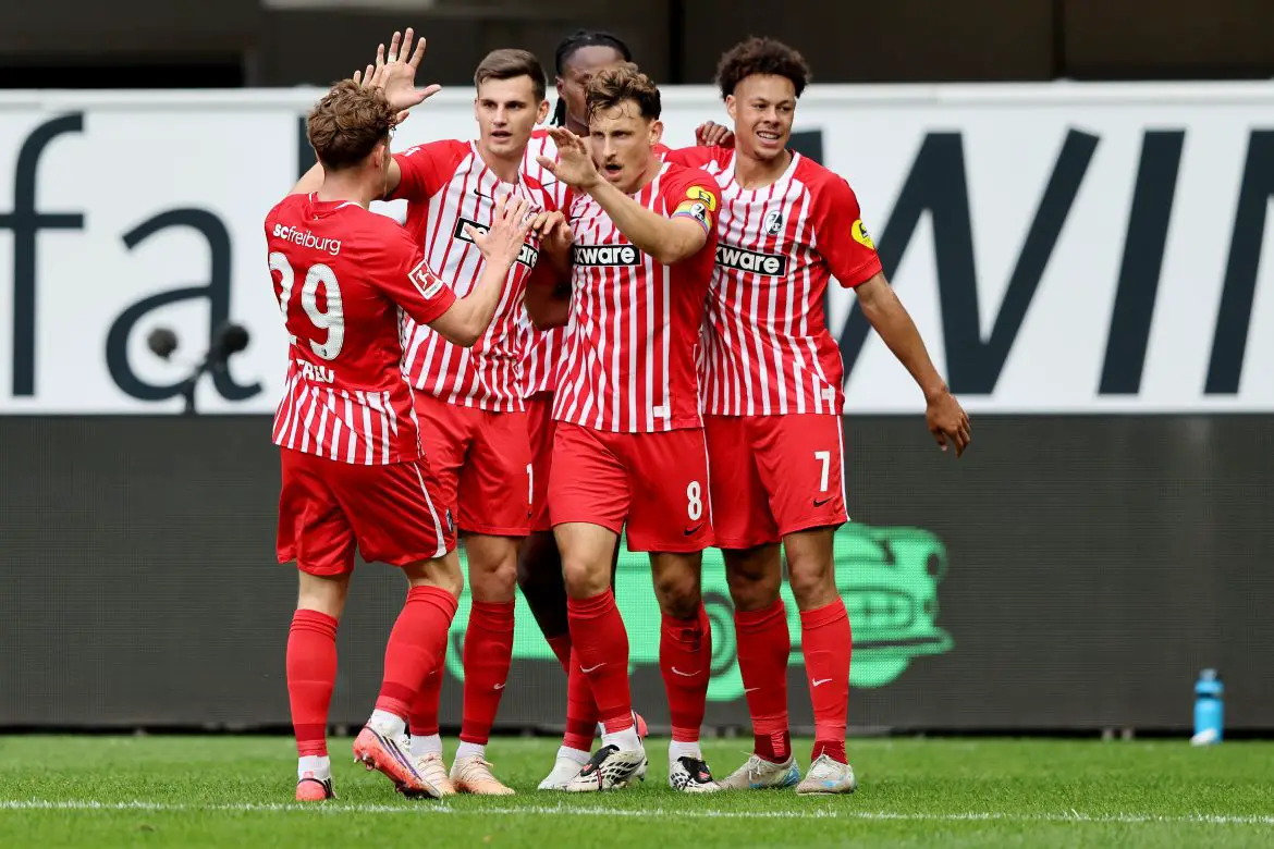 Maximilian Eggestein (#8) celebrates scoring a Bundesliga goal with Freiburg teammates.