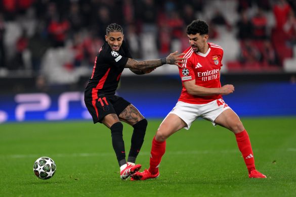 Tomas Araujo of Benfica battles for the ball against Barcelona's Raphinha.
