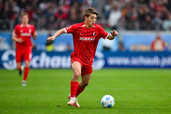 Ritsu Doan of Freiburg in action against Bayer Leverkusen in the Bundesliga.