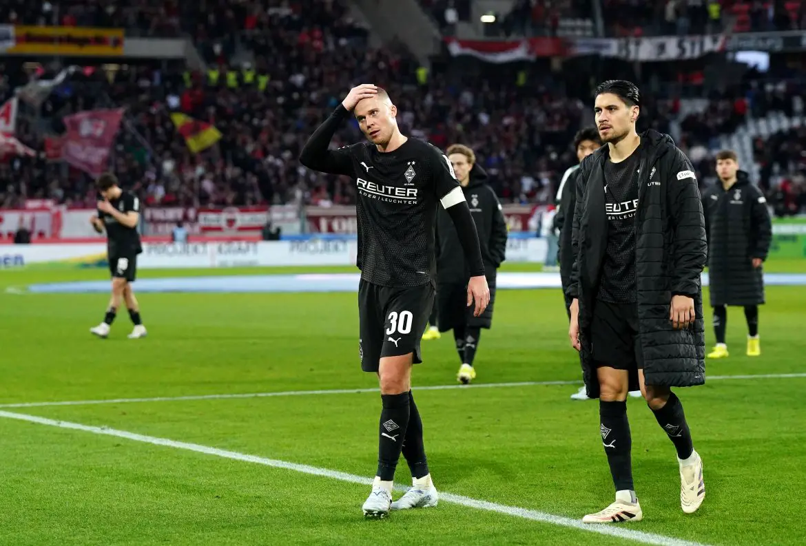Borussia Mönchengladbach teammates Nico Elvedi (left) and Kevin Diks (right) following a Bundesliga match.
