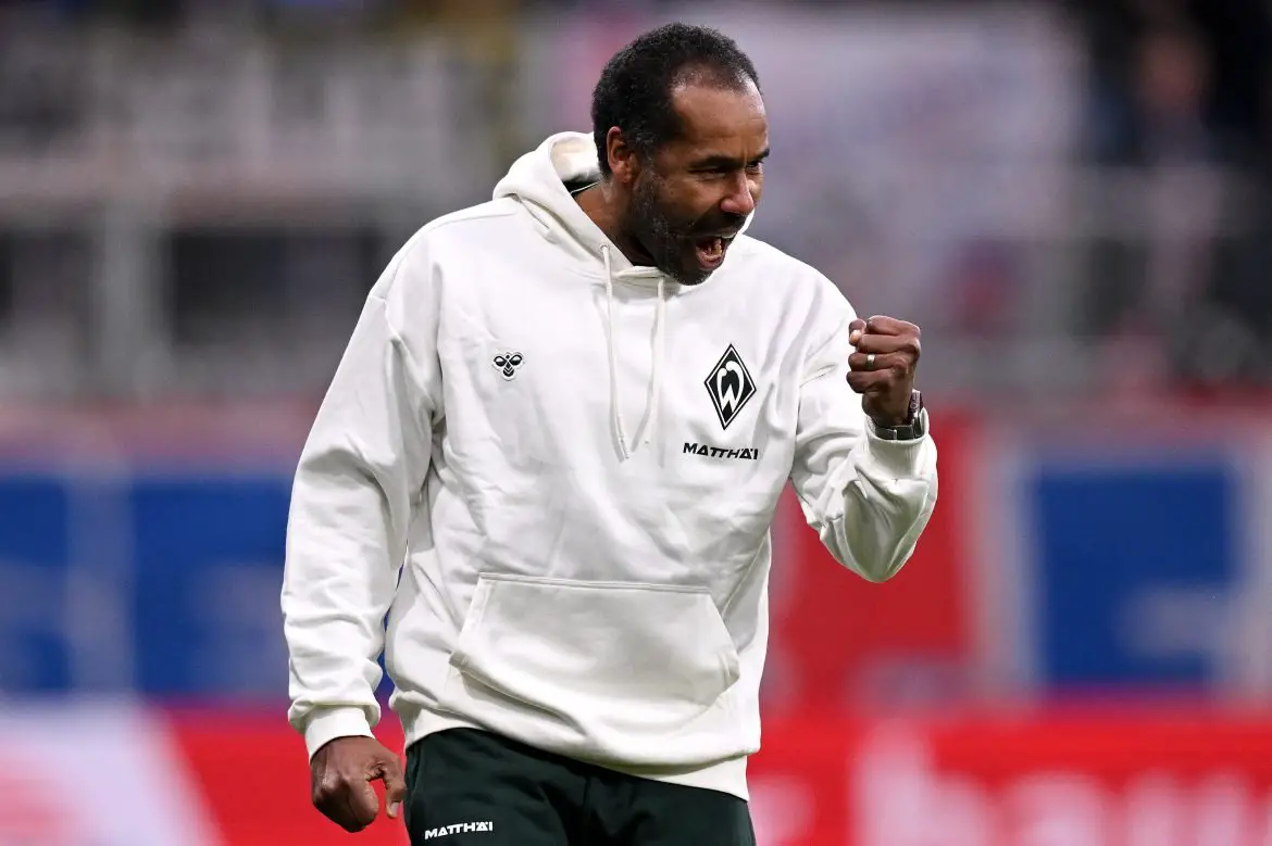 Werder Bremen head coach Daniel Thioune celebrates victory in the Bundesliga.