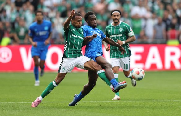 Ernest Poku (centre, blue) representing Bayer Leverkusen last weekend.