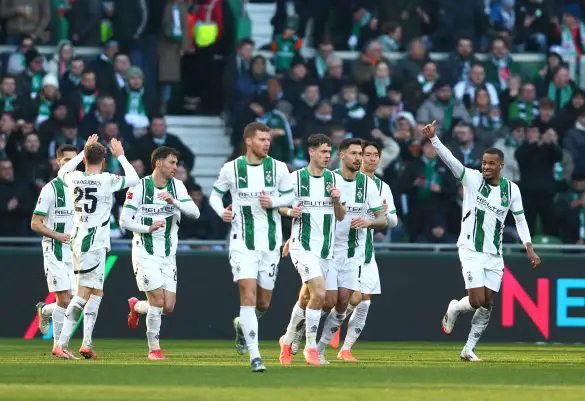 Alassane Plea celebrates with his teammates after scoring one of his three goals this afternoon.