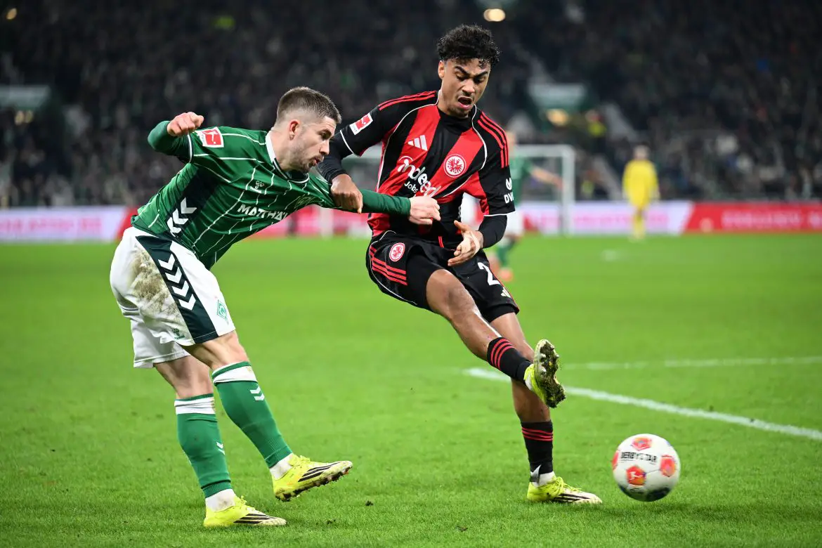 Werder Bremen's Romano Schmid (left) and Eintracht Frankfurt's Nathaniel Brown duel in Friday night's official Bundesliga "Rück-runde" opener.