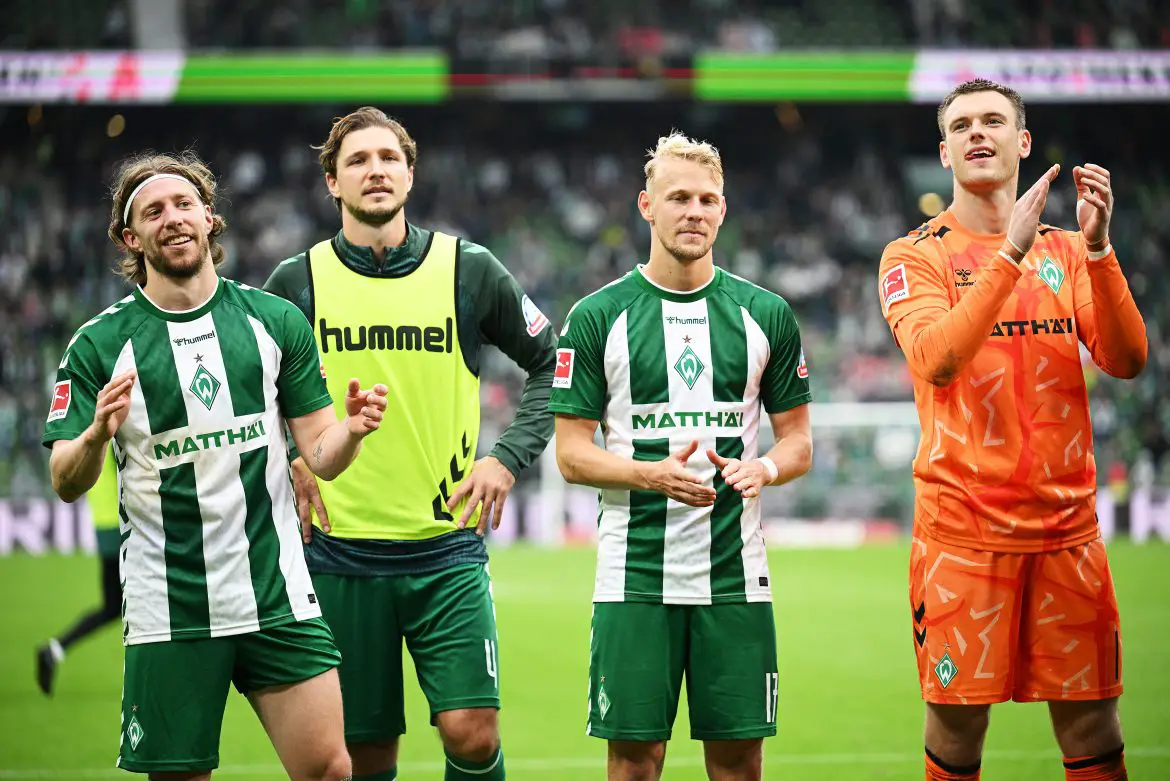 Werder Bremen's Mitchell Weiser (far left) celebrates with teammates after Saturday's Bundesliga victory.