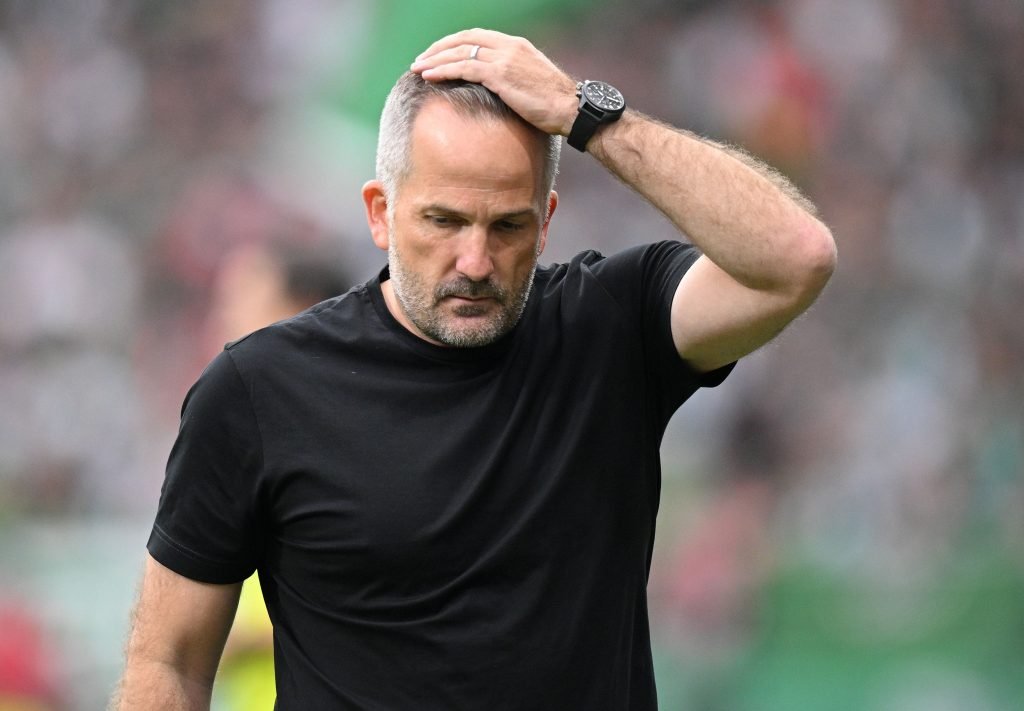 Werder Bremen and Augsburg players contest a Bundesliga match