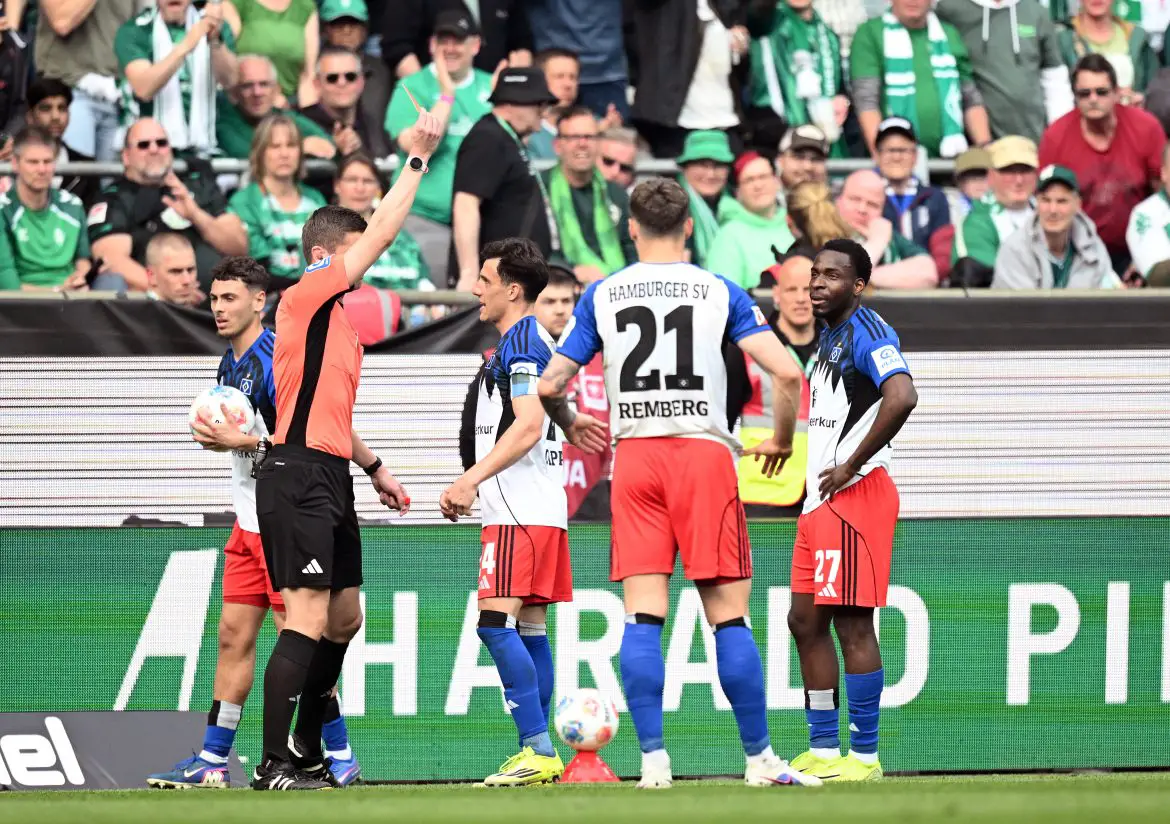 Hamburg's Philipp Otele is shown a straight red card during Saturday's Bundesliga match against Werder Bremen.
