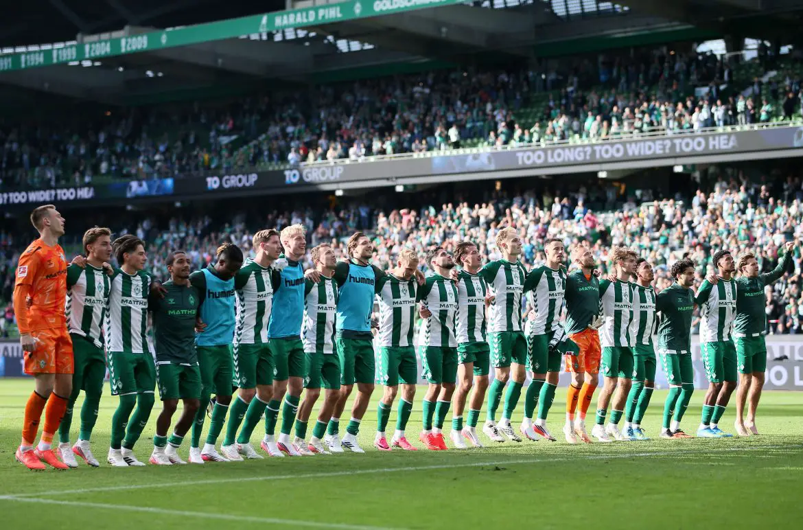 Werder Bremen players celebrate their upset Bundesliga win over RB Leipzig.