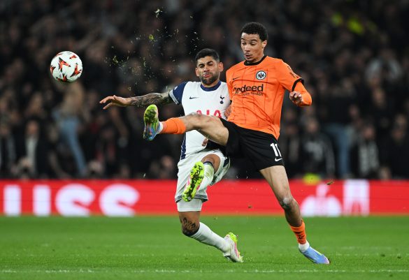 Hugo Ekitike of Eintracht Frankfurt battles with Tottenham Hotspur defender Christian Romero for the ball in the Europa League.