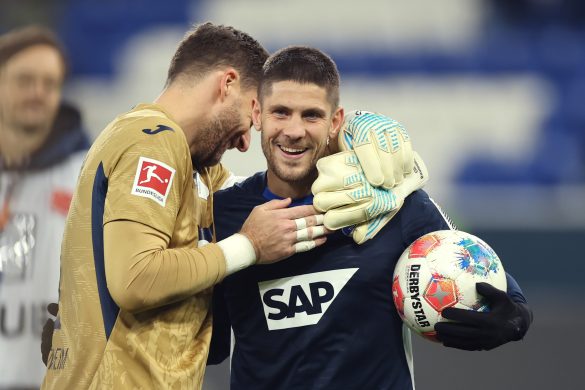 Andrej Kramarić claims the match ball after netting a hat-trick for Hoffenheim.
