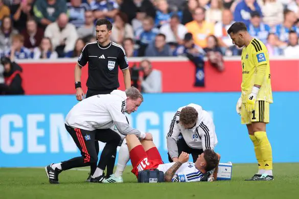 Hamburg captain Nicolai Remberg receives treatment during Saturday's Bundesliga match against Hoffenheim.