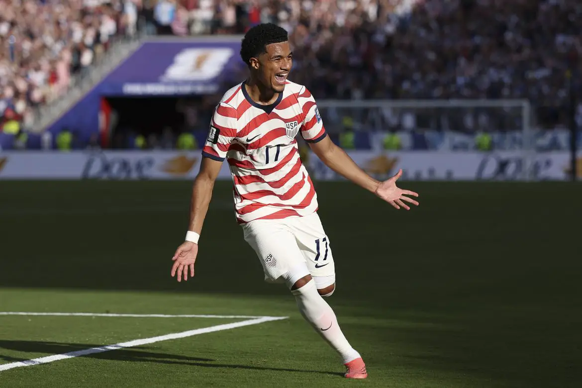 Bayer Leverkusen's Malik Tillmann celebrates scoring for the USMNT during the recent World Cup.