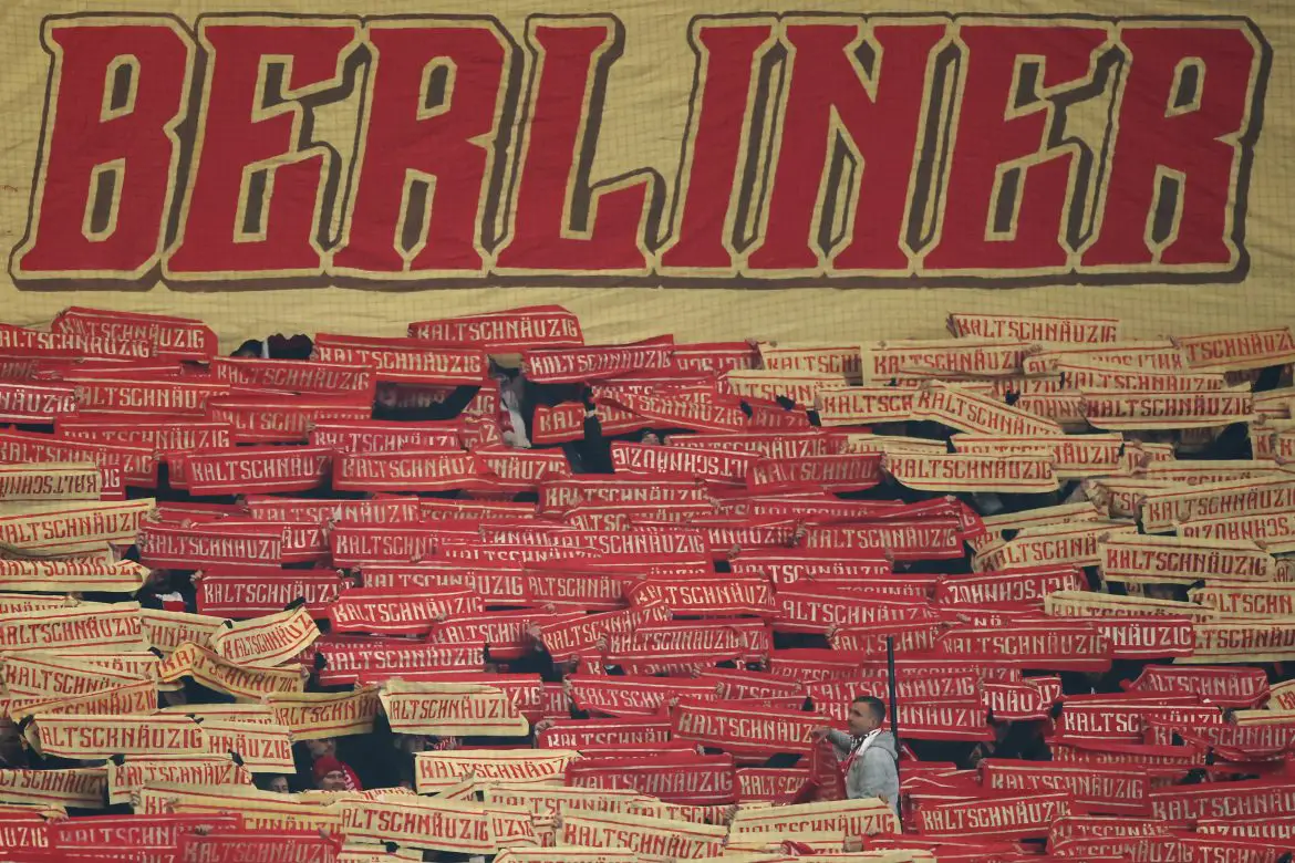 Fans of 1. FC Union Berlin support their club at an away Bundesliga match.