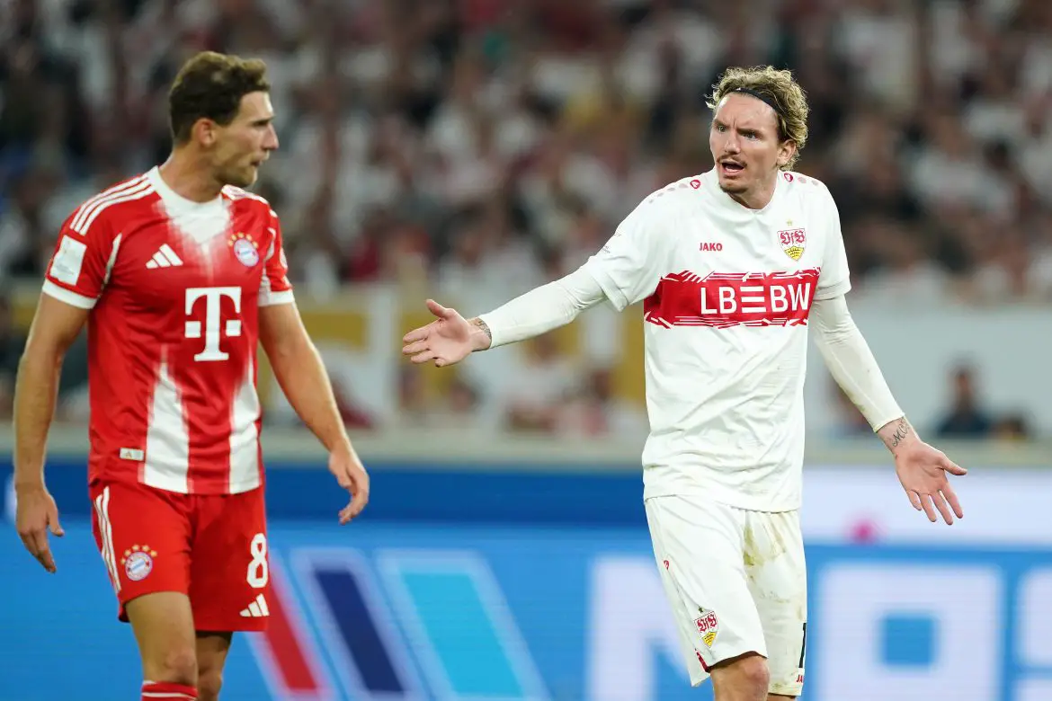 Nick Woltemade of Stuttgart argues with Bayern Munich midfielder Leon Goretzka.