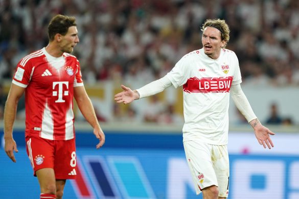 Nick Woltemade of Stuttgart argues with Bayern Munich midfielder Leon Goretzka.